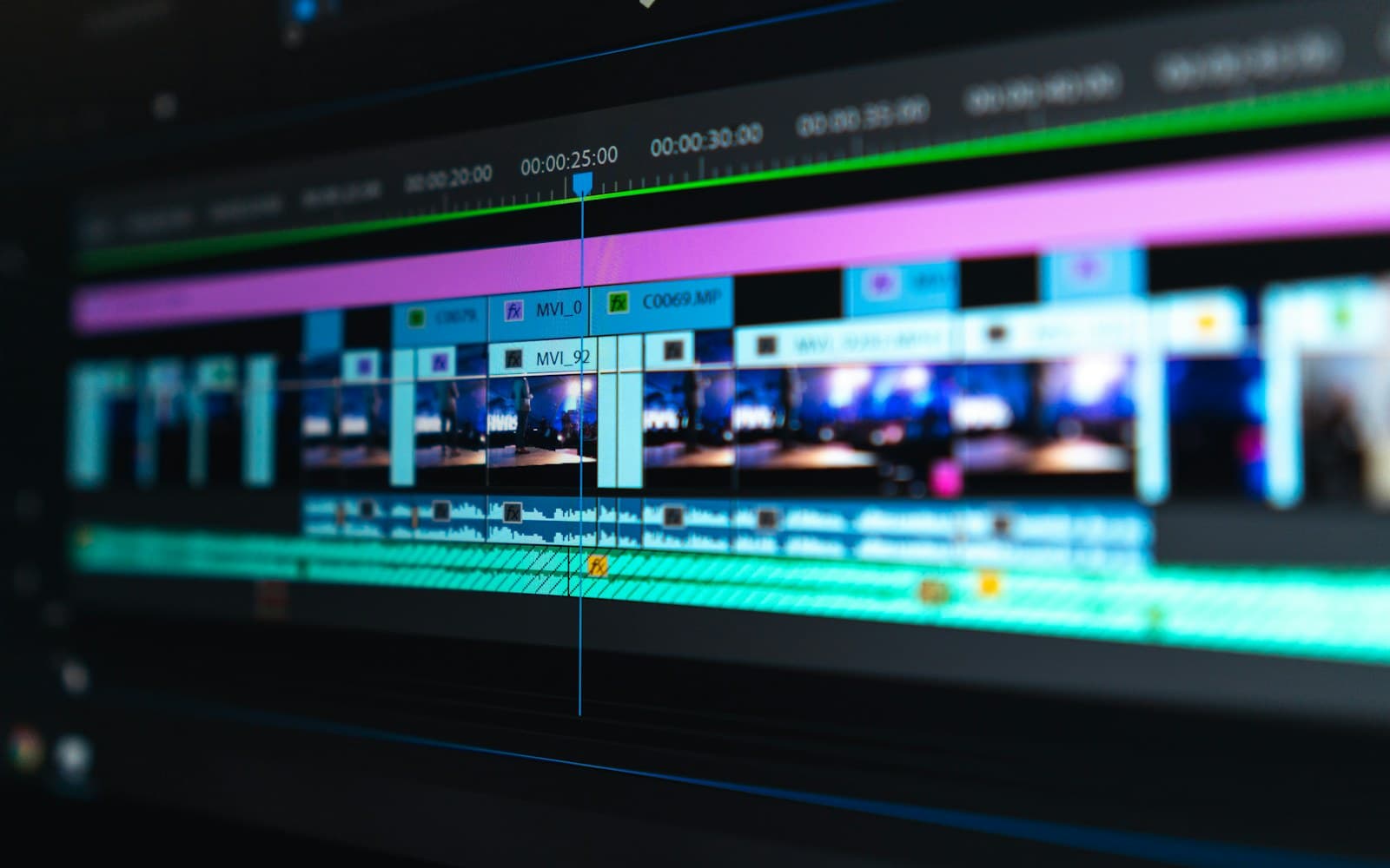 A video editing timeline with coloured clips across several tracks